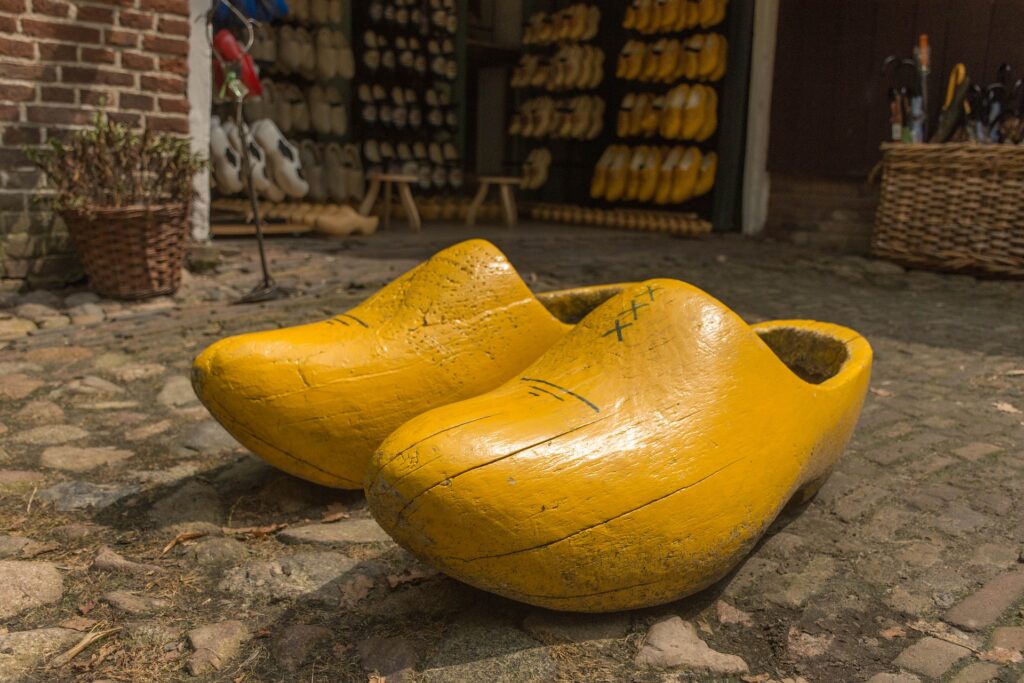 yellow wooden clogs